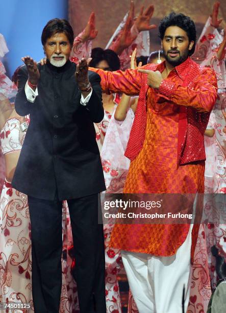 Bollywood actors Amitabh Bachchan and his son Abhishek Bachchan perform on stage at the International Indian Film Academy Awards at the Sheffield...