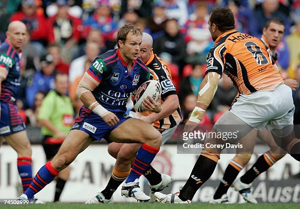 Luke MacDougall of the Knights runs the ball during the round 13 NRL match between the Newcastle Knights and the Wests Tigers at EnergyAustralia...