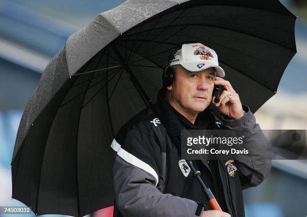 Tigers coach Tim Sheens coaches his team from the sideline during the round 13 NRL match between the Newcastle Knights and the Wests Tigers at...