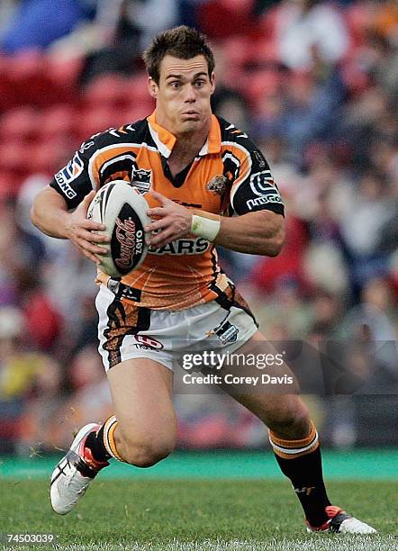 John Morris of the Tigers runs the ball during the round 13 NRL match between the Newcastle Knights and the Wests Tigers at EnergyAustralia Stadium...