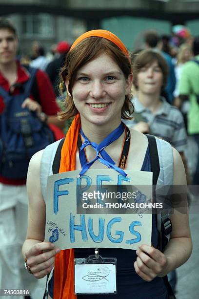 Young participant of the 31st German Protestant Church Day offers "Free hugs" 10 June 2007 in Cologne. Thousands have travelled to the western German...