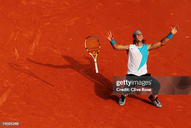 Rafael Nadal of Spain celebrates winning match point against Roger Federer of Switzerland during the Men's Singles Final on day fifteen of the French...