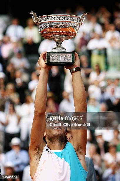 Rafael Nadal of Spain poses with the Philippe Chatrier Trophy after winning against Roger Federer of Switzerland in the Men's Singles Final on day...