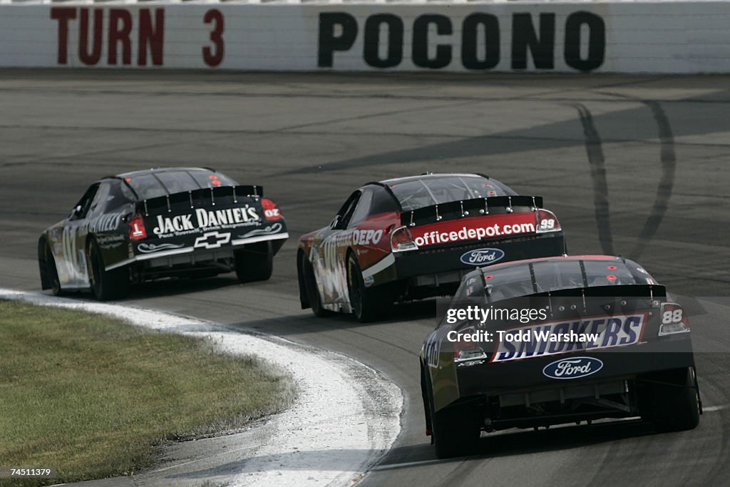 Pocono Ricky Rudd Ricky Rudd, driver of the Snickers Ford, follows behind Carl Edwards ...