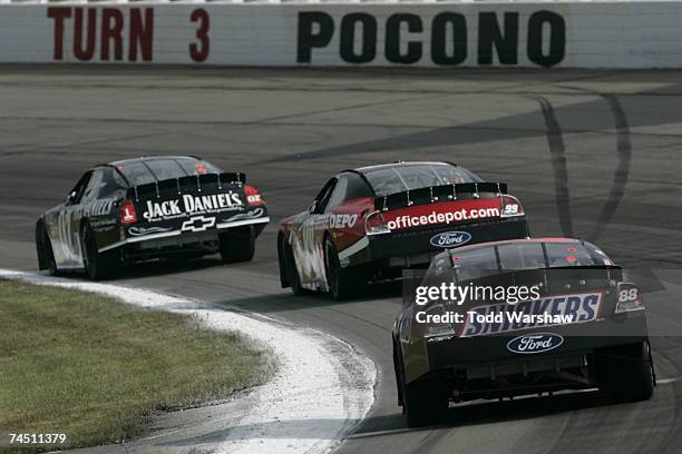 Snickers Dark Car Ricky Rudd Ricky Rudd, driver of the Snickers Ford, follows behind Carl Edwards ...
