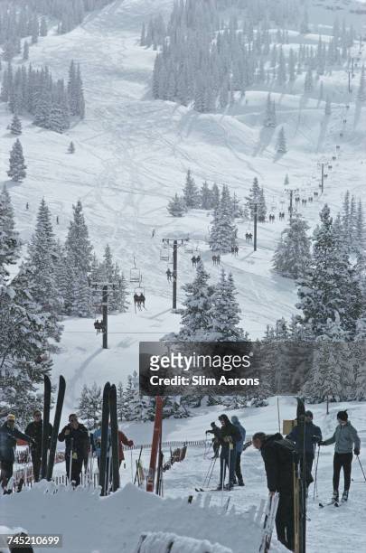 Group of skiers stand in line waiting for the ski lift in Vail, Colorado, USA, 1964.