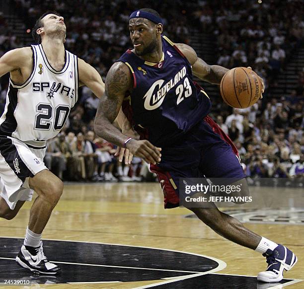 San Antonio, UNITED STATES: LeBron James of the Cleveland Cavaliers gets past Manu Ginobili of the San Antonio Spurs 10 June 2007 during game two of...