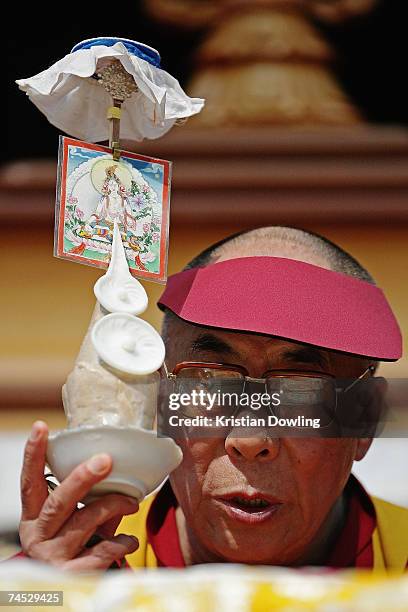 The Dalai Lama prays during his Buddhist blessing - White Tara Long Life Empowerment at Geelong Arena June 11, 2007 in Melbourne, Australia. The...