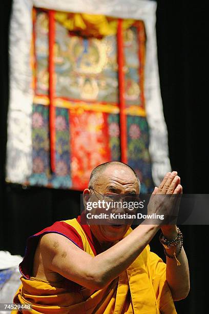 The Dalai Lama greets the crowd during his Buddhist blessing - White Tara Long Life Empowerment at Geelong Arena June 11, 2007 in Melbourne,...