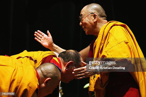 The Dalai Lama blesses attending monks during his Buddhist blessing - White Tara Long Life Empowerment at Geelong Arena June 11, 2007 in Melbourne,...