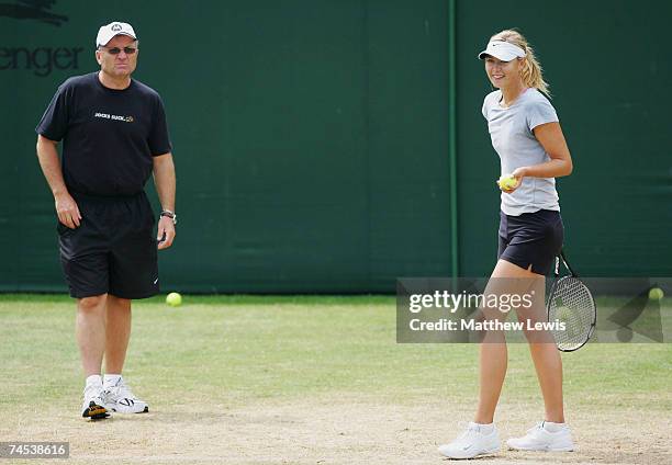 Yuri Sharapova lwatches as his daughter Maria Sharapova of Russia warms up during the DFS Classic at the Edgbaston Priory Club on June 11, 2007 in...