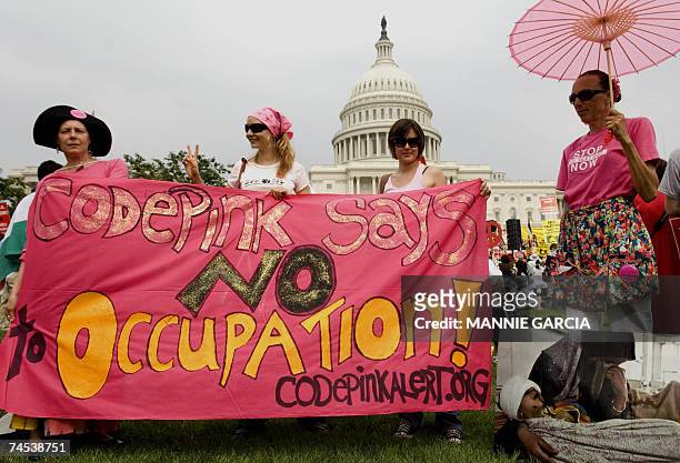 Washington, UNITED STATES: Members of Code Pink along with thousands of people gather at the West Mall near the US Capitol building to mark the 40...