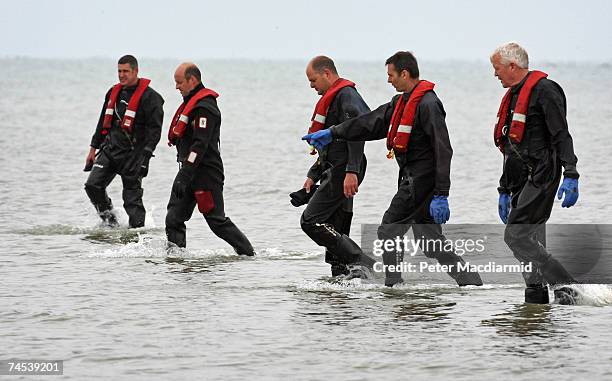 Sussex police divers conduct a search on the the sea off Littlehampton on June 11, 2007 in West Sussex, England. A boy, thought to be aged about two,...