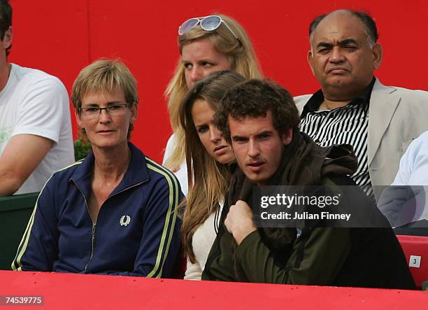 Andy Murray watches his brother Jamie in action alongside girlfriend Kim Sears and mother, Judy Murray during the doubles first round match between...