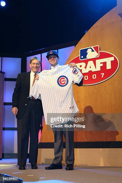 Allan H. "Bud" Selig, Major League Baseball Commissioner, left and Joshua Vitters, first round pick of the Chicago Cubs smile for a photo during the...