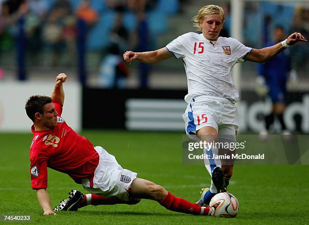 James Milner of England tackles Frantisek Rajtoral of Czech Republic during the UEFA U21 Championship, group B match between Czech Republic U21 and...