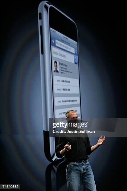 Apple CEO Steve Jobs delivers the keynote address in front of a projected image of the soon to be released iPhone at the Apple Worldwide Web...