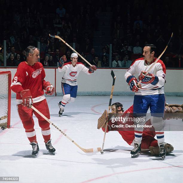 Gordie Howe of the Detroit Red Wings watches as the Montreal Canadiens celebrate a goal during their NHL game in Montreal, Canada.