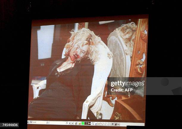 Los Angeles, UNITED STATES: A crime scene photograph of actress Lana Clarkson is shown during the murder trial of music producer Phil Spector 11 June...