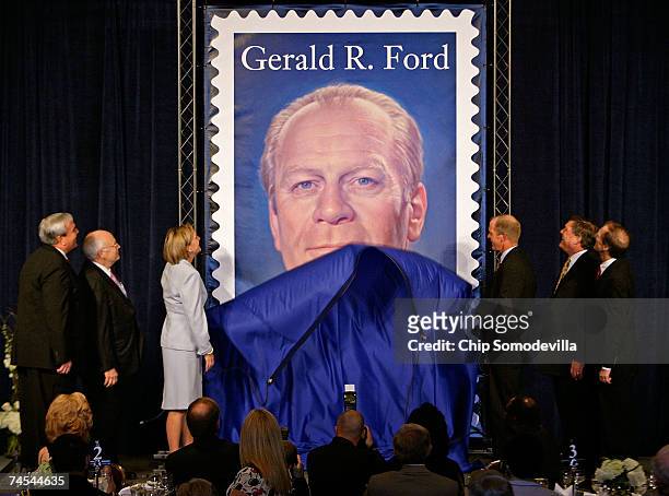 Postmaster General Jack Potter, U.S. Vice President Dick Cheney, and Ford's children Susan Ford Bales, Steve Ford, Jack Ford and Mike Ford unveil the...