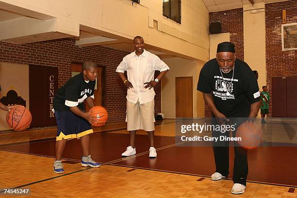 Caron Butler of the Washington Wizards supervises the dribbling station during the Caron Butler 3D Youth Basketball Camp on June 11, 2007 at the...