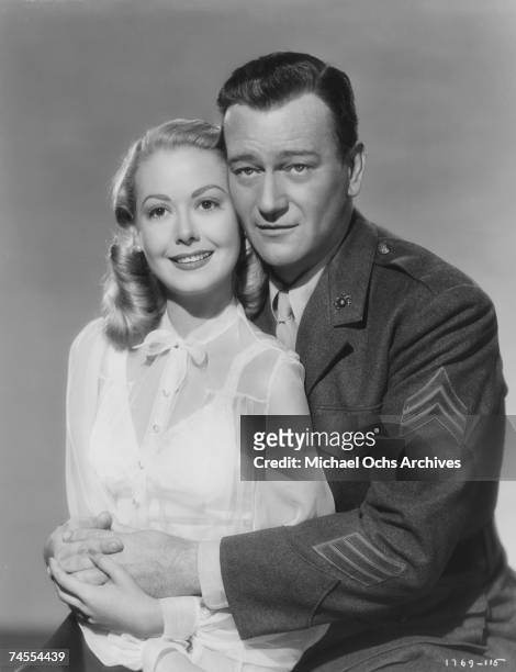 John Wayne and Adele Mara on the set of "Sands Of Iwo Jima" directed by Allan Dwan circa 1949 in Los Angeles, California.
