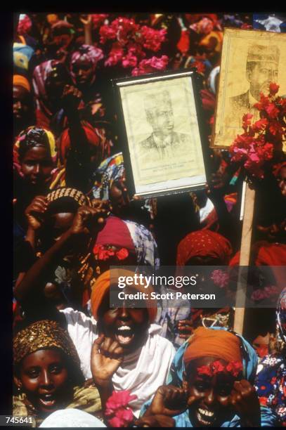 Demonstrators cheer at a rally for General Mohammad Farrah Aidid October 14, 1993 in Mogadishu, Somalia. A powerful warlord, Aidid continues to rally...