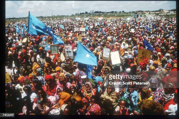 Demonstrators cheer at a rally for General Mohammad Farrah Aidid October 14, 1993 in Mogadishu, Somalia. A powerful warlord, Aidid continues to rally...