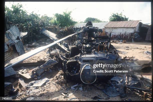 The wreckage of an American helicopter sits October 14, 1993 in Mogadishu, Somalia. This Blackhawk helicopter, which was used to root out ammo...