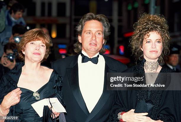 American actor Michael Douglas attending the premiere of Oliver Stone's film 'Wall Street' with his wife Diandra, right, and another guest, 27th...