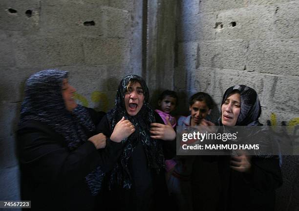 Relatives of Jamal Abu al-Jadian, a head for northern Gaza of Al-Aqsa Martyrs Brigades, loosely affiliated to Fatah mourn during his funeral in Beit...