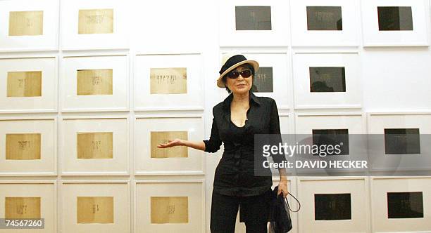 Japanese-born artist Yoko Ono, widow of John Lennon, poses 12 June 2007 in Bremen in front of her works, during the presentation of her exhibition...