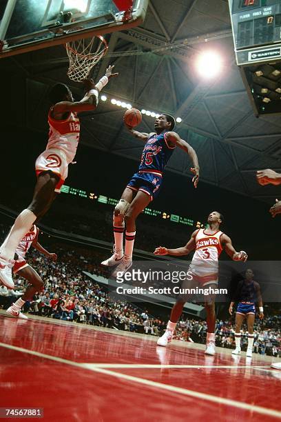 Albert King of the New Jersey Nets elevates for a dunk against the Atlanta Hawks during a 1983 NBA game at the Omni Coliseum in Atlanta, Georgia....