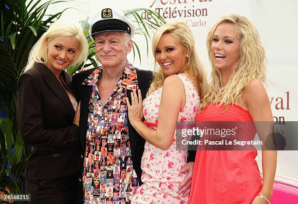 Playmate Holly Madison, Hugh Hefner, playmates Bridget Marquardt and Kendra Wilkinson attend a photocall promoting the television serie 'Girls Next...