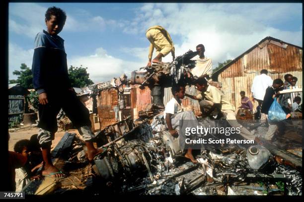 Children play on helicopter wreckage December 9, 1993 in Mogadishu, Somalia. On October 3, Somali militiamen shot down two US Blackhawk helicopters,...