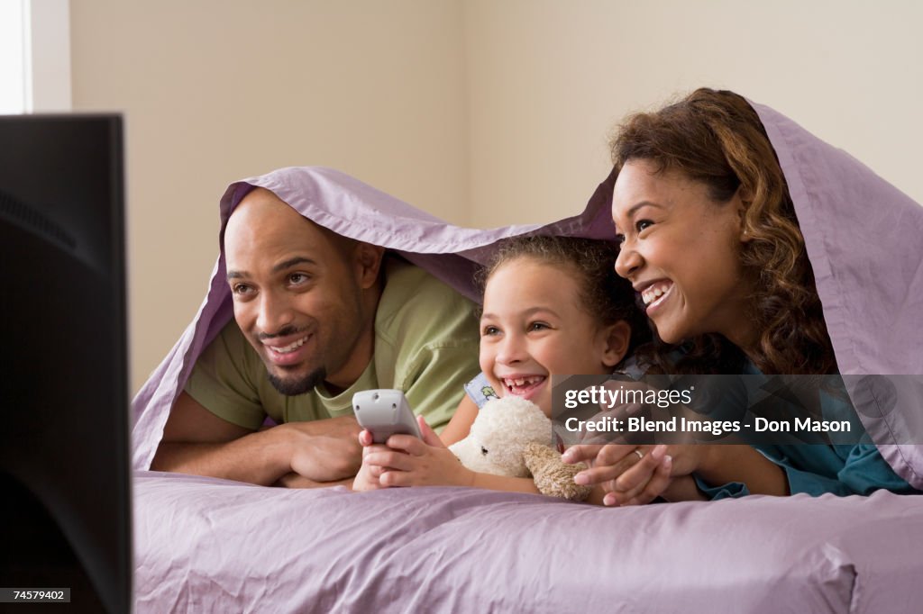 African family watching television