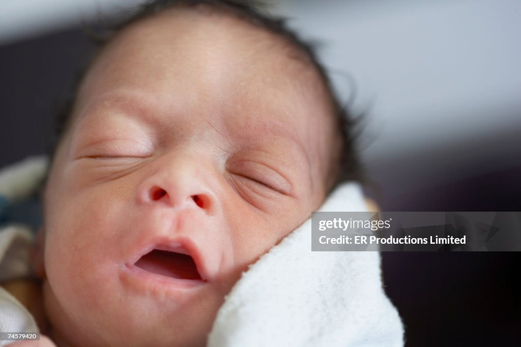 Close up of newborn African baby sleeping