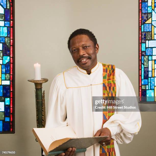 african male religious figure in church - ceremonial robe fotografías e imágenes de stock