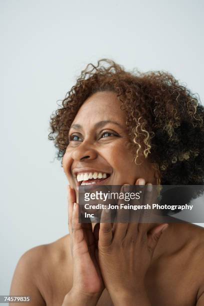 african woman with bare shoulders - beautiful older black women stock pictures, royalty-free photos & images