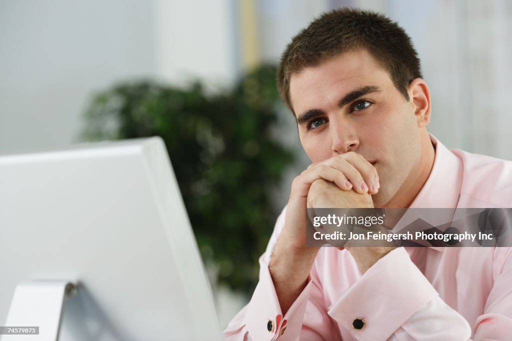 Middle Eastern businessman sitting at desk