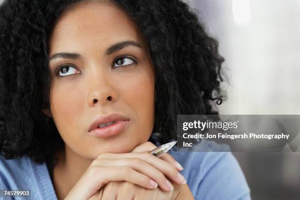 african businesswoman thinking - ignoring stock pictures, royalty-free photos & images