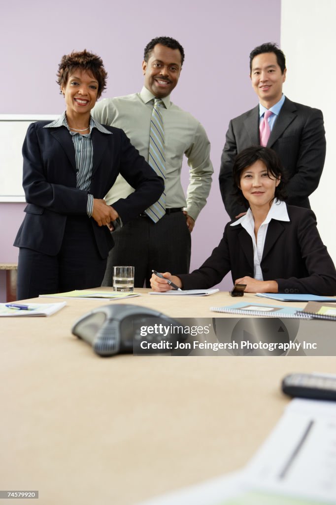 Multi-ethnic businesspeople at conference table