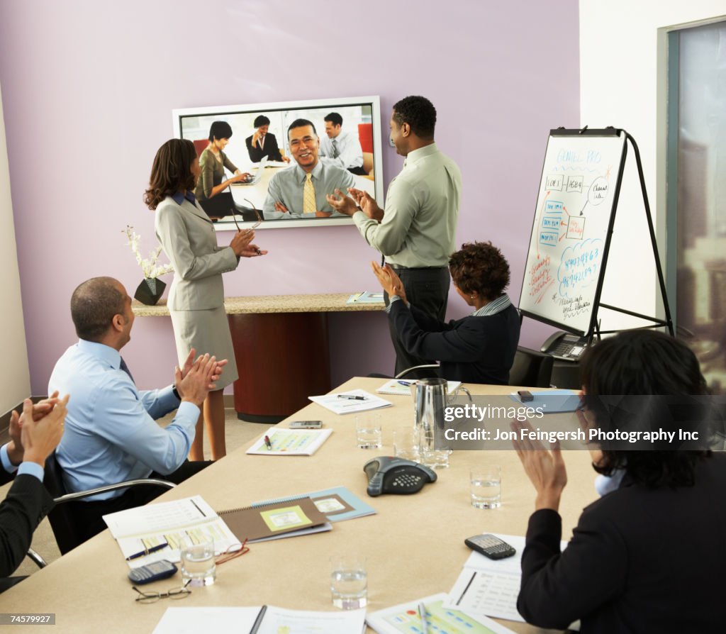 Multi-ethnic businesspeople having video conference