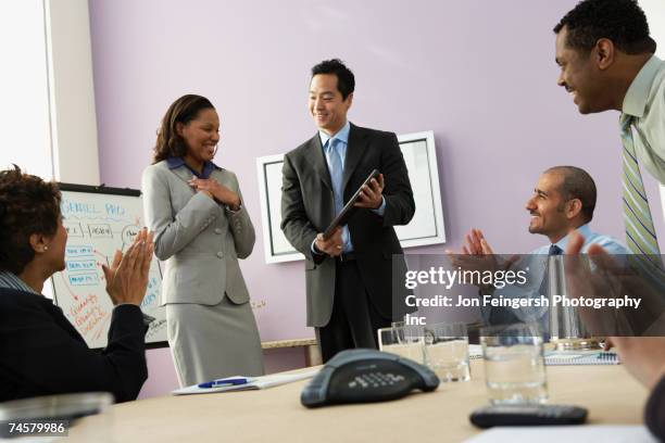 businesswoman receiving plaque - colleague appreciation stock pictures, royalty-free photos & images