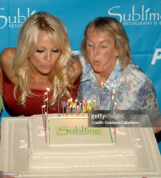 Pamela Anderson and PETA President Ingrid E. Newkirk blow out the candles on her 40th birthday cake at Sublime restaurant where PETA hosted her 40th...