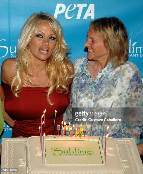 Pamela Anderson and PETA President Ingrid E. Newkirk blow out the candles on her 40th birthday cake at Sublime restaurant where PETA hosted her 40th...
