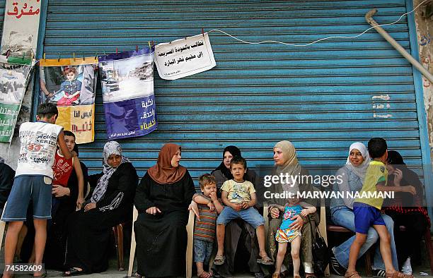 Palestinian refugees, who fled their besieged camp of Nahr al-Bared in north Lebanon, take part in a symbolic sit-in, in the refugee camp of Burj...