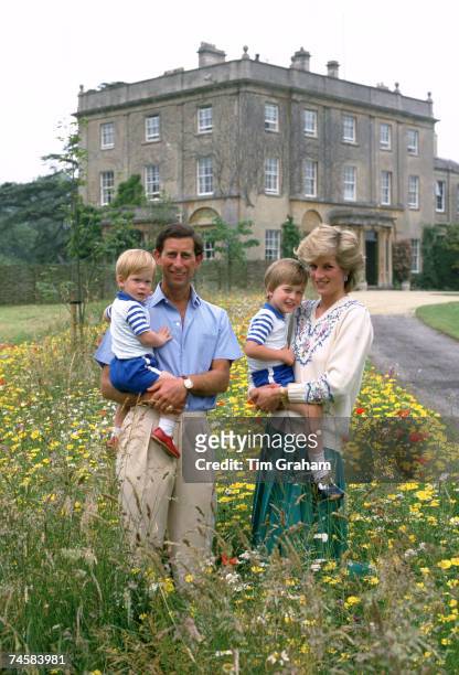 Prince Charles, Prince of Wales and Diana, Princess of Wales pose with their sons Prince William and Prince Harry in the wild flower meadow at...