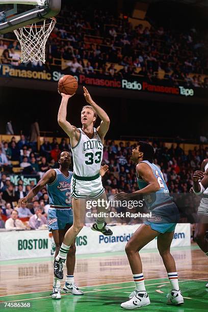 Larry Bird of the Boston Celtics attempts a shot against the Sacramento Kings during a 1980s NBA game at the Boston Garden in Boston, Massachusetts....