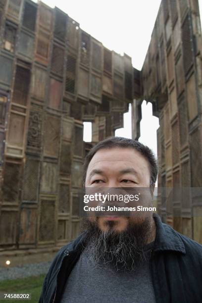 Chinese Artist Ai Weiwei poses in front of his sculpture 'Template' during a media preview of Documenta 12 on June 13, 2007 in Kassel, Germany. The...